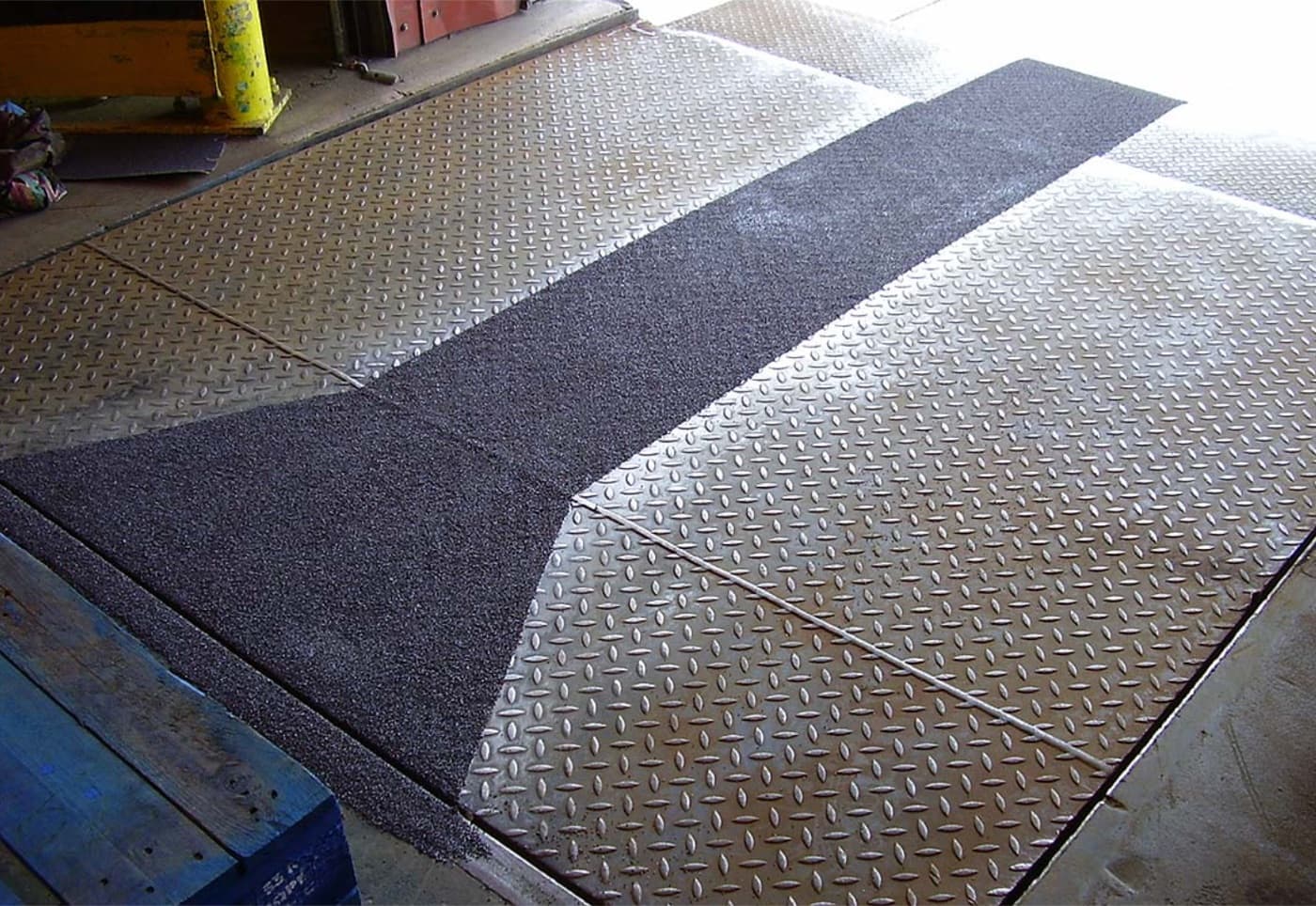 Plant walkway resurfaced with an anti-slip safety floor by CM Solutions US